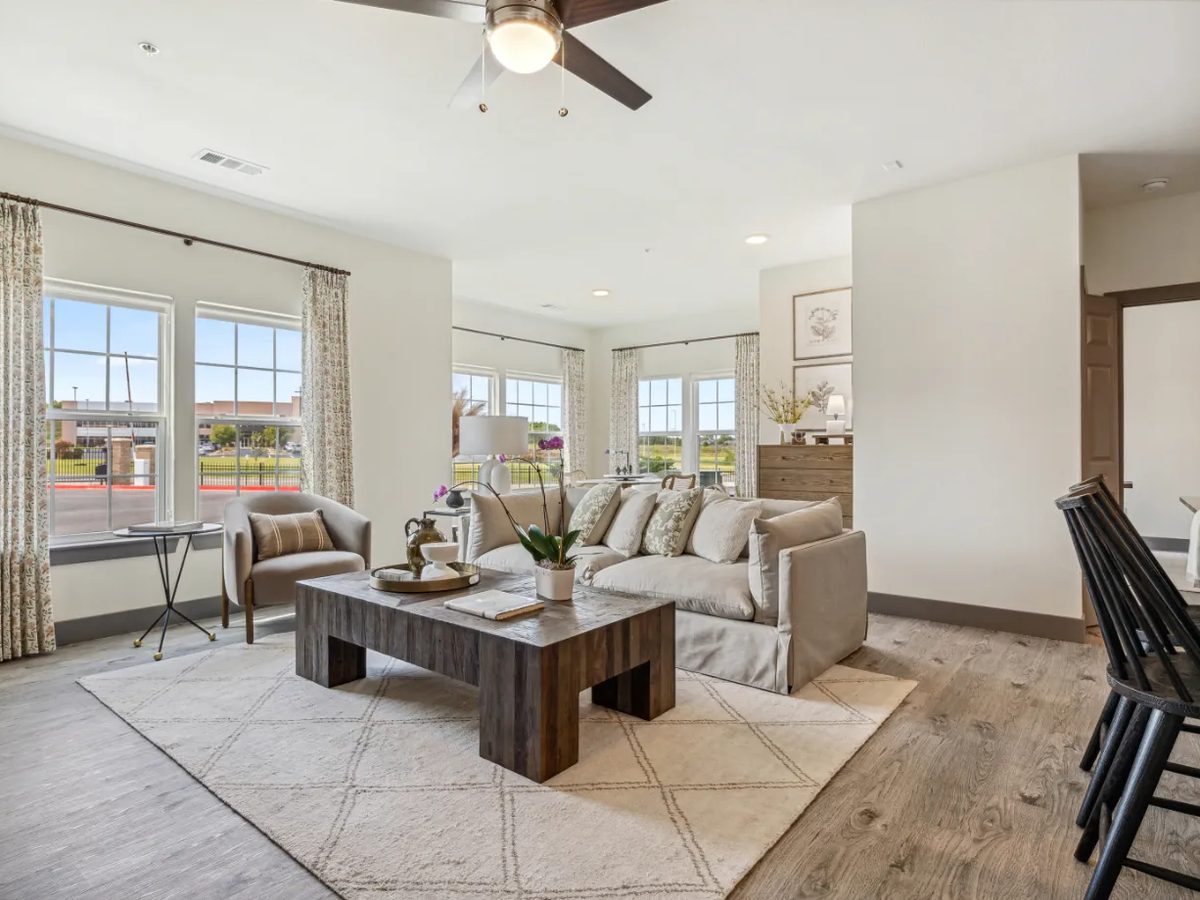 Finished multi-family unit living room with fresh paint and trim