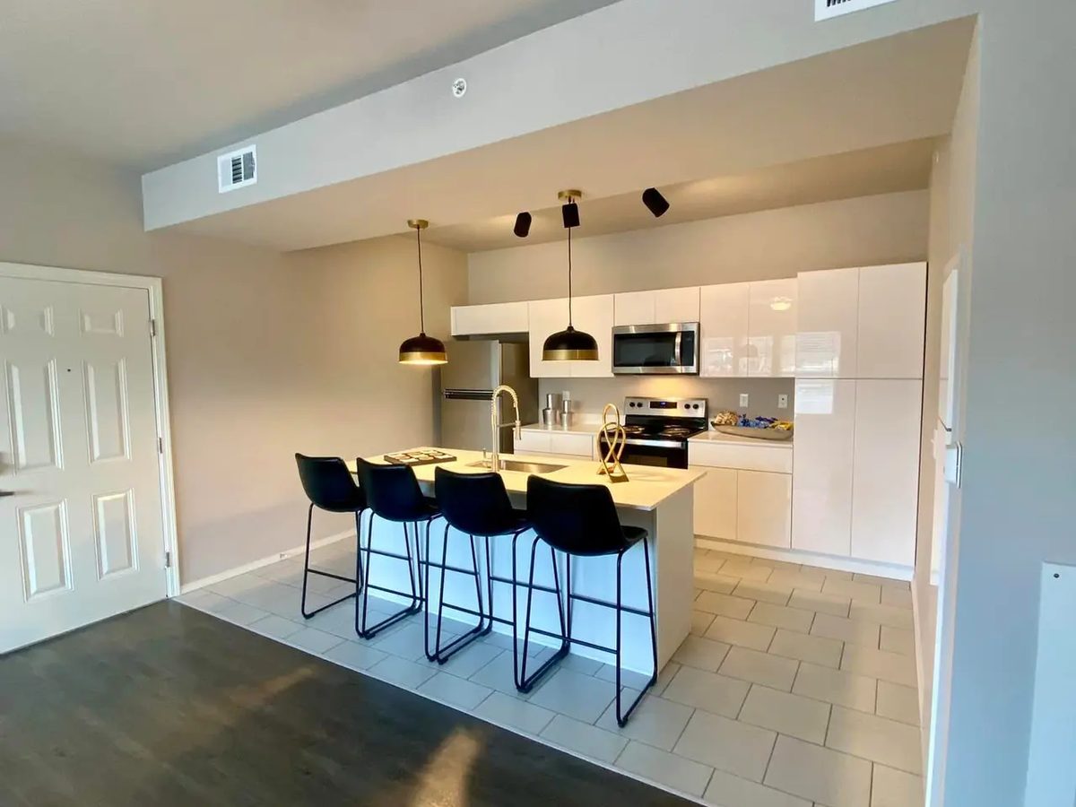 Finished apartment kitchen with clean painted walls and ceiling