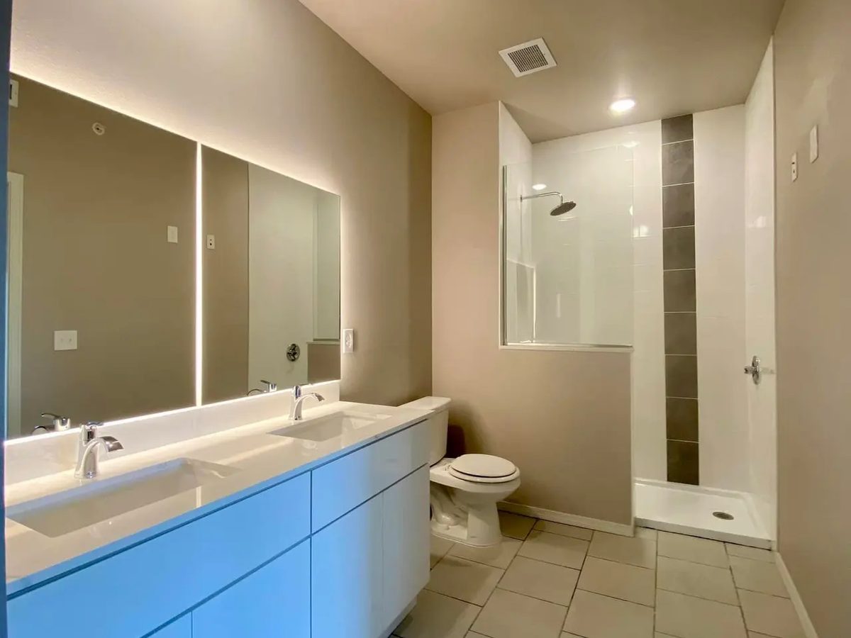 Finished apartment bathroom with painted walls and clean tile